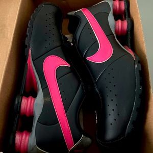Woman’s Nike black and pink with gray, size 7.5